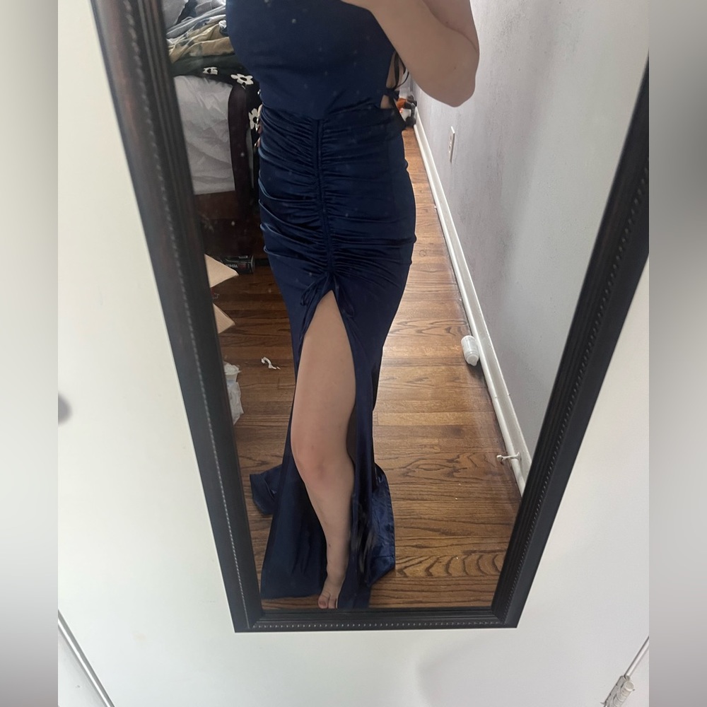This is a full length navy blue formal dress